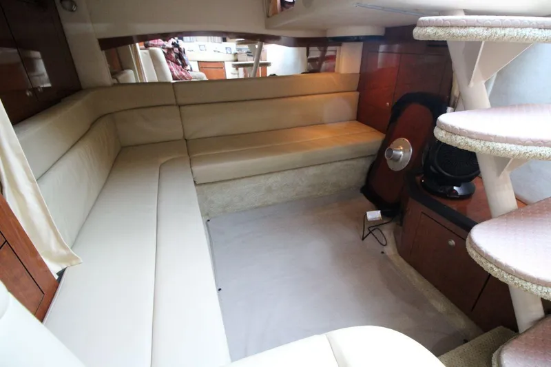 Slide: The Image of Luxurious interior of 2006 Sea Ray 340 Sundancer yacht with elegant seating and cozy bed. - 13