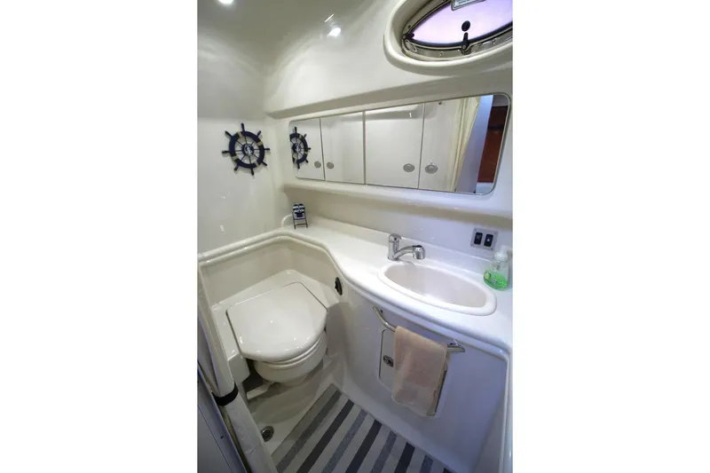 Slide: The Image of Luxurious interior of 2006 Sea Ray 340 Sundancer with curved leather seating. - 14