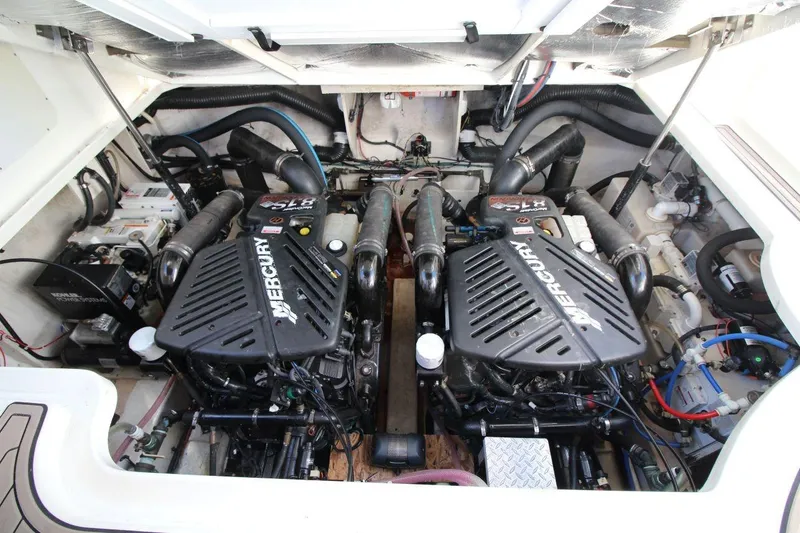 Slide: The Image of Engine compartment of 2006 Sea Ray 340 Sundancer with twin Mercury engines. - 19