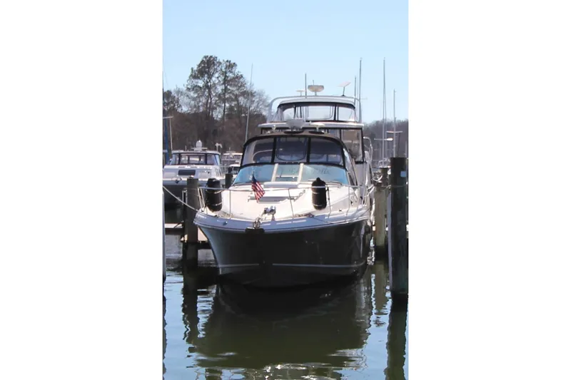 Slide: The Image of 2006 Sea Ray 340 Sundancer yacht docked at marina, front view. - 2