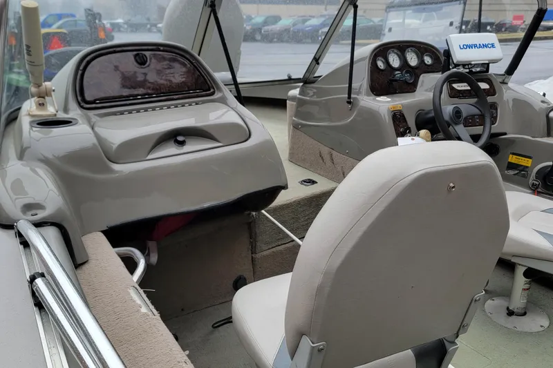 Slide: The Image of 2002 Tracker Tundra 18 WT boat interior with steering console and seating. - 9