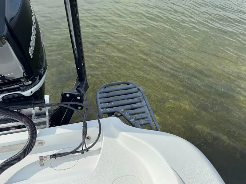 Slide: The Image of 2021 Yellowfin 26 Hybrid boat with Mercury engine in shallow water. - 35