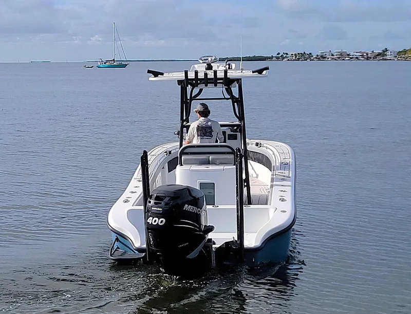 Slide: The Image of 2021 Yellowfin 26 Hybrid boat with Mercury 400 engine on calm water. - 3