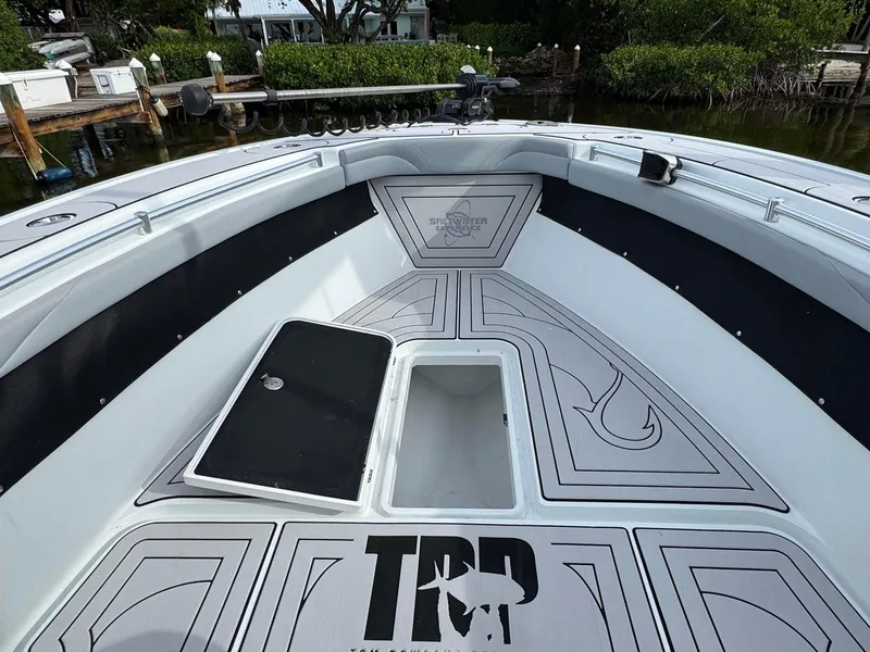 Slide: The Image of 2021 Yellowfin 26 Hybrid boat interior with custom deck design and storage compartment. - 18
