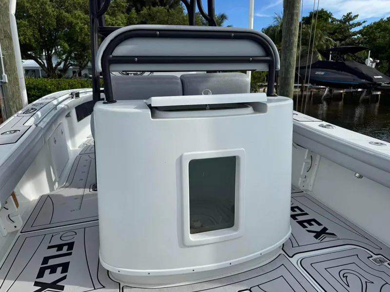 Slide: The Image of 2021 Yellowfin 26 Hybrid boat interior with seating and storage compartment. - 27