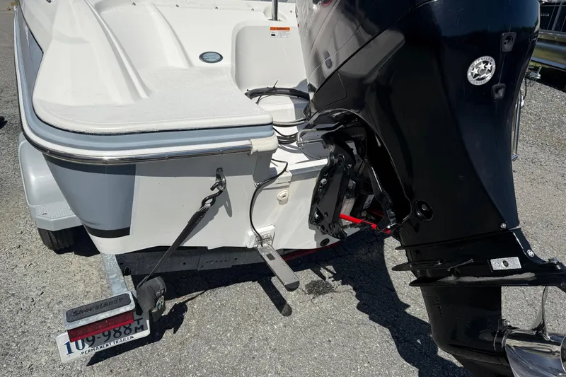 Slide: The Image of 2014 Larson LX 160S OB boat with outboard motor on trailer. - 22