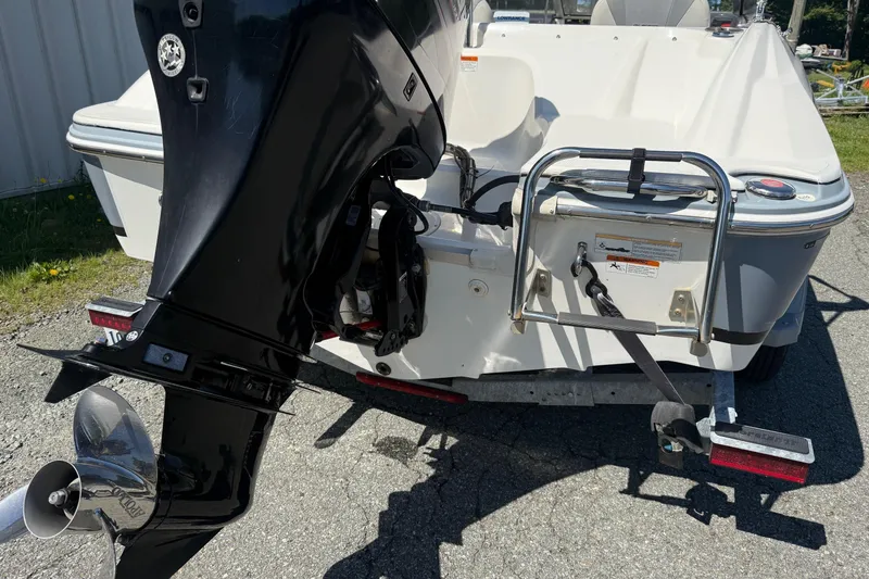Slide: The Image of 2014 Larson LX 160S OB boat rear view with outboard motor and trailer. - 27