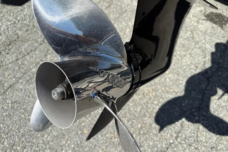 Slide: The Image of Close-up of a shiny boat propeller on a 2014 Larson LX 160S OB. - 28