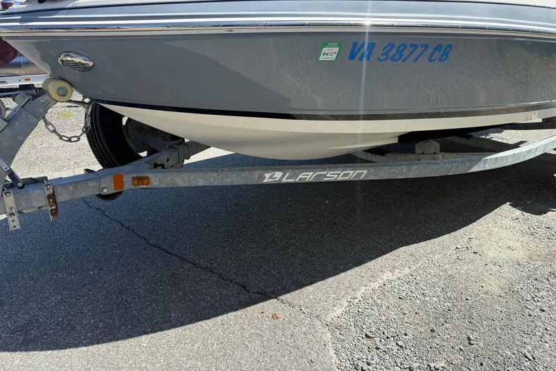 Slide: The Image of 2014 Larson LX 160S OB boat on trailer, displaying registration number VA 3877 CB. - 32