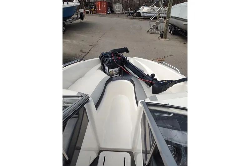 Slide: The Image of 2014 Larson LX 160S OB boat interior with seating and equipment. - 4