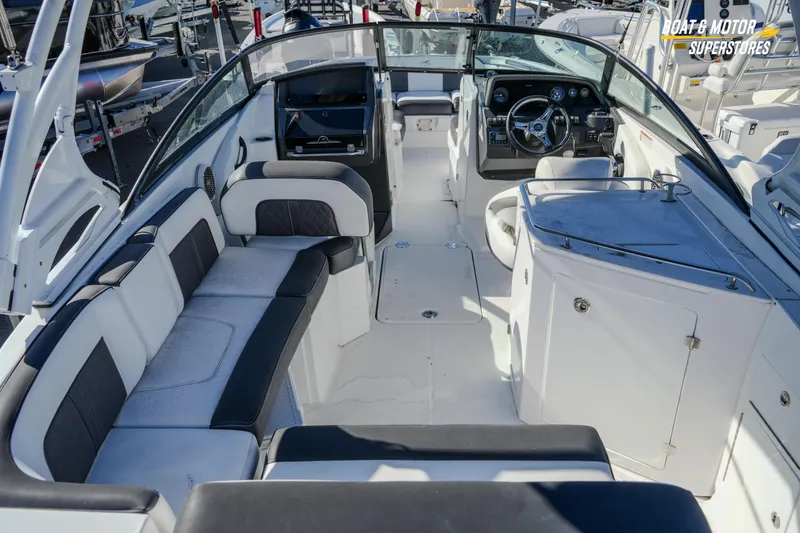 Slide: The Image of Interior of a 2020 Monterey M-65 boat with seating and helm. - 18
