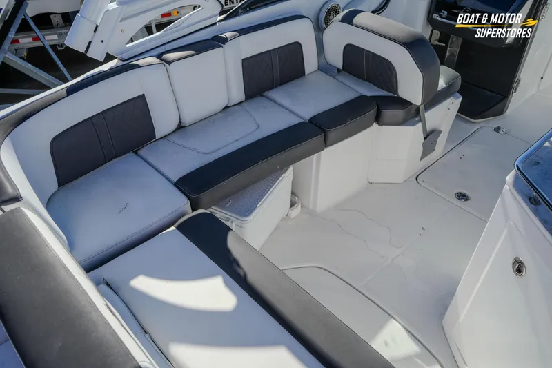 Slide: The Image of Luxurious seating area on a 2020 Monterey M-65 boat, featuring sleek black and white upholstery. - 20