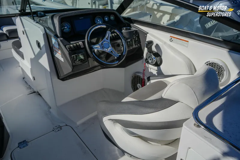 Slide: The Image of 2020 Monterey M-65 boat cockpit with steering wheel and control panel. - 23