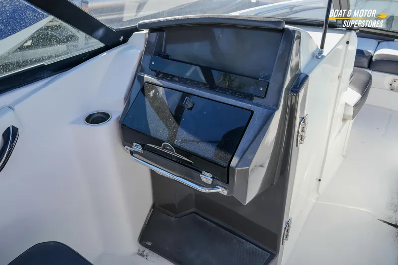 Slide: The Image of 2020 Monterey M-65 boat interior with sleek dashboard and seating area. - 27