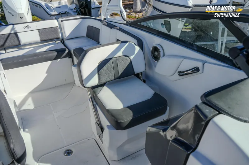Slide: The Image of Interior of a 2020 Monterey M-65 boat with cushioned seating and speaker system. - 35