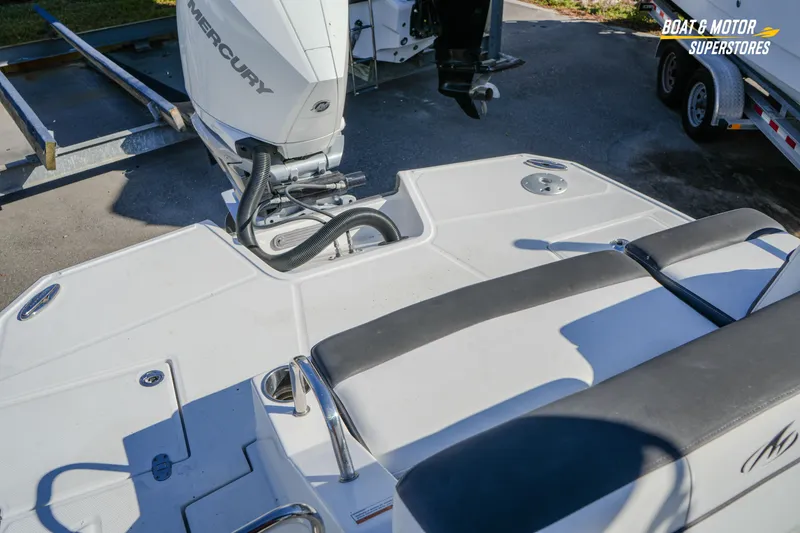 Slide: The Image of 2020 Monterey M-65 boat with Mercury engine, featuring spacious deck and seating area. - 42