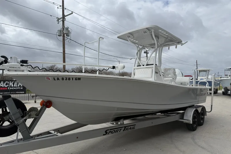 Slide: The Image of 2021 Blazer Bay 2400 boat on trailer under cloudy sky. - 5