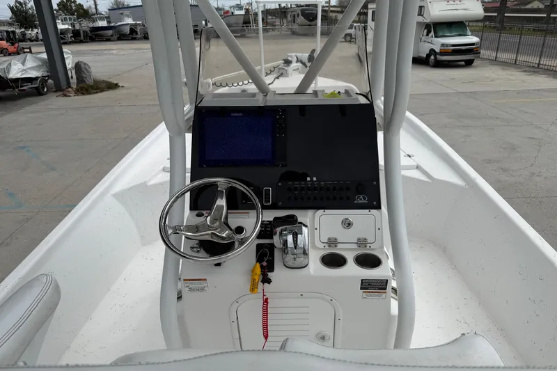 Slide: The Image of 2021 Blazer Bay 2400 boat console with steering wheel and navigation system. - 9