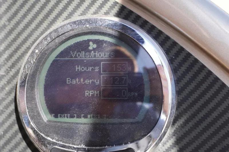 Slide: The Image of Close-up of a Massimo Marine P23 MAX LIMITED 2021 dashboard display showing battery and hours. - 10