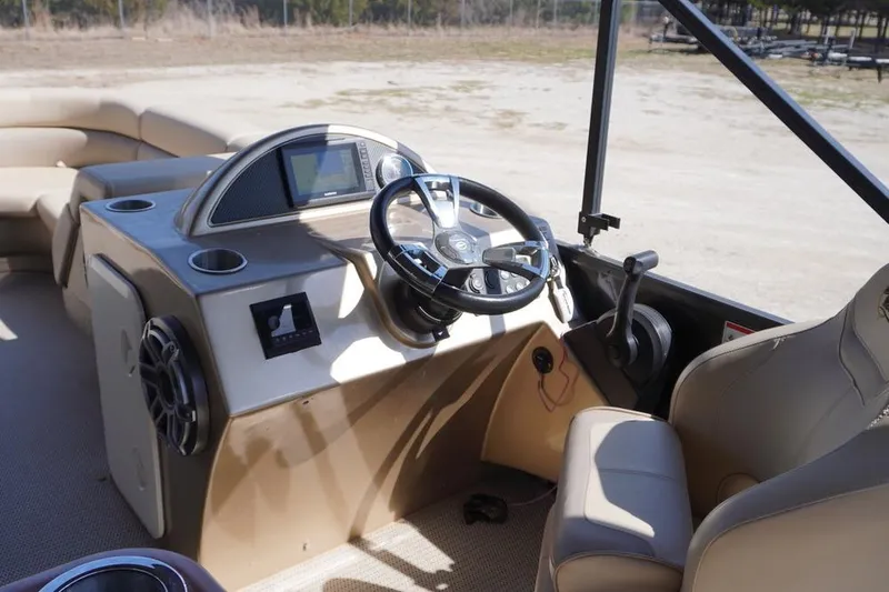 Slide: The Image of Interior of 2021 Massimo Marine P23 MAX LIMITED boat with steering wheel and seating. - 9