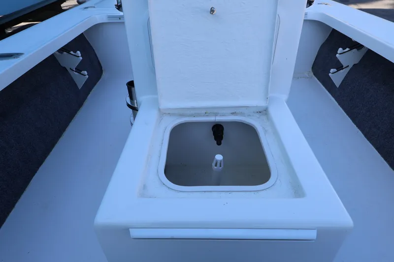 Slide: The Image of 2026 Mitzi Skiffs 17 Tournament boat interior with open storage compartment. - 21
