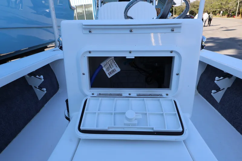 Slide: The Image of Open storage compartment on 2026 Mitzi Skiffs 17 Tournament boat, showcasing interior details. - 22