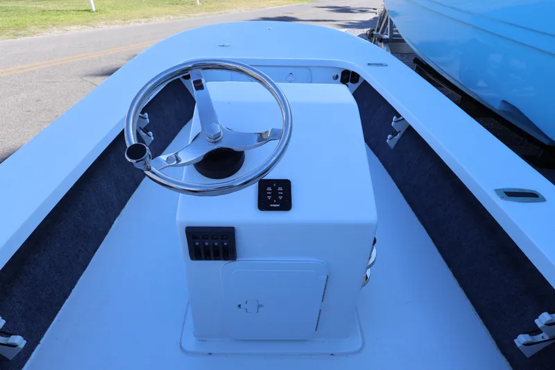 Slide: The Image of 2026 Mitzi Skiffs 17 Tournament boat interior with steering wheel and console. - 23