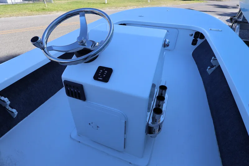 Slide: The Image of 2026 Mitzi Skiffs 17 Tournament boat interior with steering wheel and control panel. - 24
