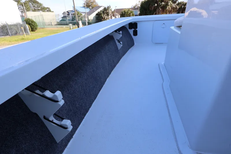 Slide: The Image of Interior view of 2026 Mitzi Skiffs 17 Tournament boat, showcasing rod holders and storage. - 26