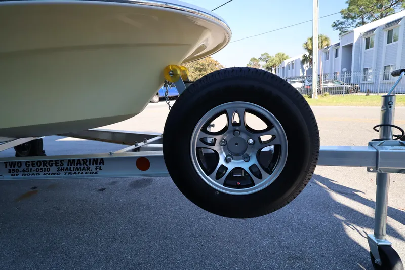 Slide: The Image of Trailer with Mitzi Skiffs 17 Tournament boat, 2026 model, at Two Georges Marina. - 27