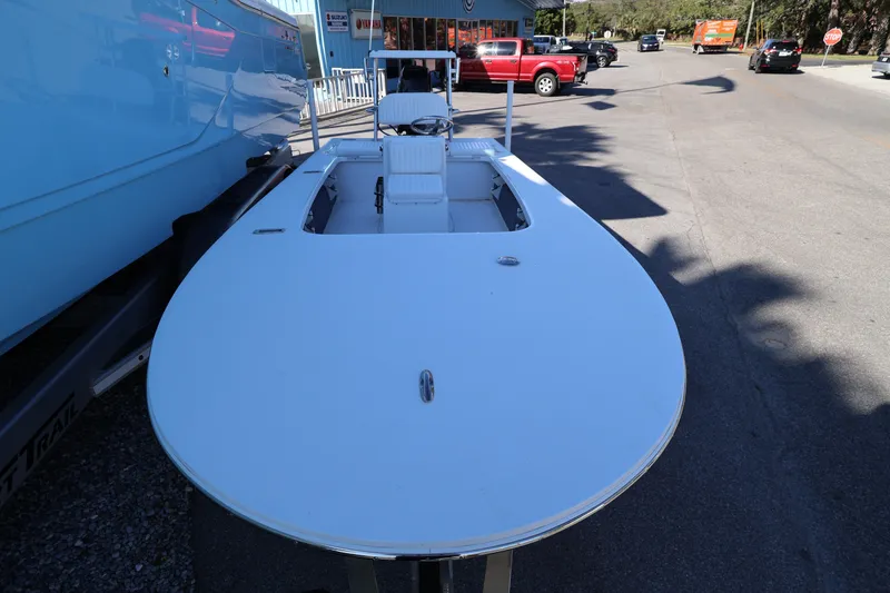 Slide: The Image of 2026 Mitzi Skiffs 17 Tournament boat parked on a street, showcasing sleek design. - 7