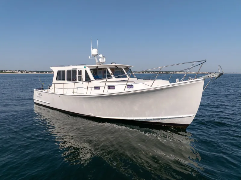 Slide: The Image of 2016 Wesmac 42 boat cruising on open water under clear skies. - 3