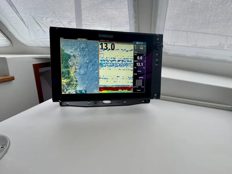Slide: The Image of Simrad marine display on 2016 Wesmac 42 boat, showing navigation and sonar data. - 36