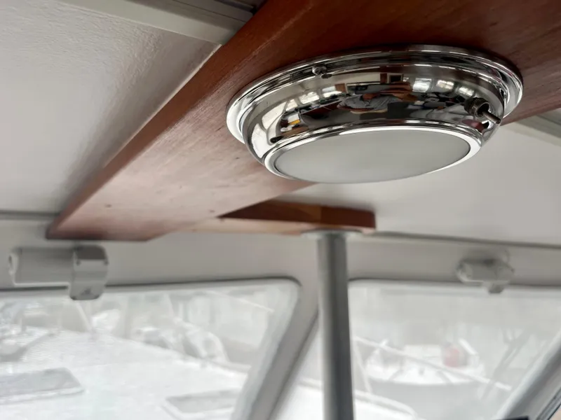 Slide: The Image of Interior of 2016 Wesmac 42 boat with modern ceiling light fixture. - 28
