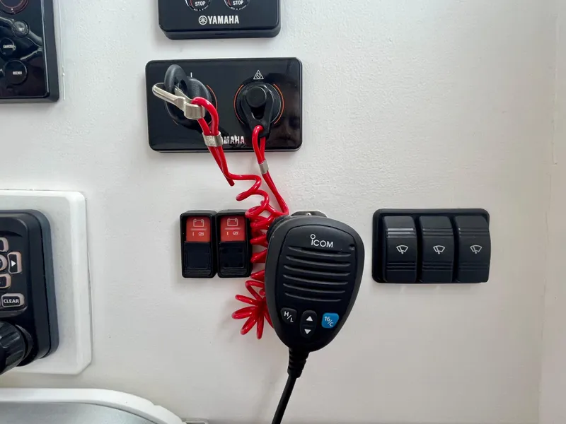Slide: The Image of Boat control panel with Icom radio and Yamaha switches, Wesmac 42, 2016 model. - 39