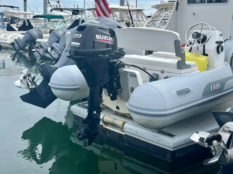 Slide: The Image of Inflatable boat with Suzuki outboard motor docked near Wesmac 42, 2016 model. - 6