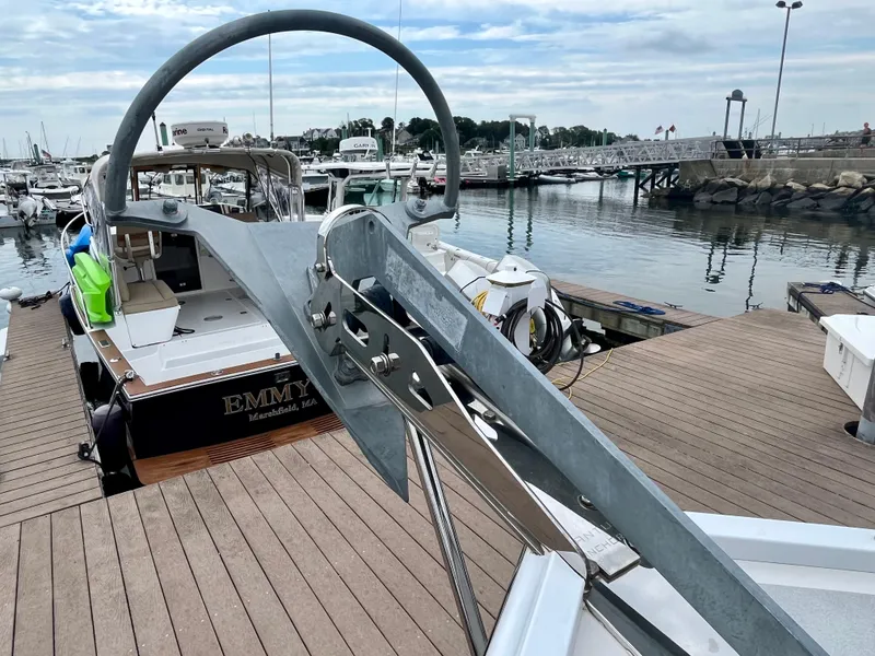 Slide: The Image of Wesmac 42 boat docked at marina, 2016 model, with visible anchor and deck. - 19