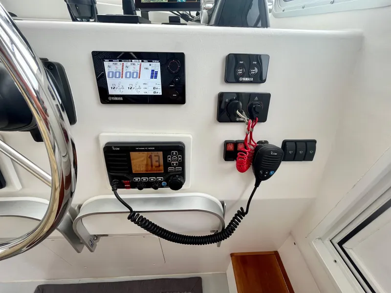 Slide: The Image of Control panel of a 2016 Wesmac 42 boat with navigation and communication equipment. - 35