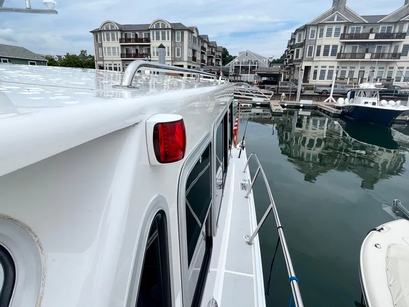Slide: The Image of Wesmac 42 yacht docked in marina with waterfront buildings, 2016 model. - 21