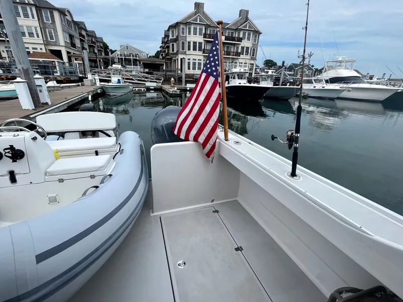 Slide: The Image of Wesmac 42 boat docked at marina, American flag, 2016 model. - 12