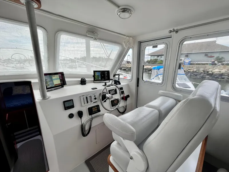Slide: The Image of Interior of 2016 Wesmac 42 boat with modern navigation equipment and comfortable seating. - 33