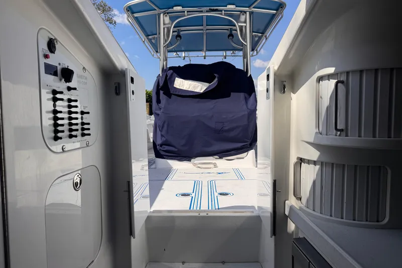 Slide: The Image of 2004 Don Smith 45 Custom boat interior with control panel and covered seating area. - 17