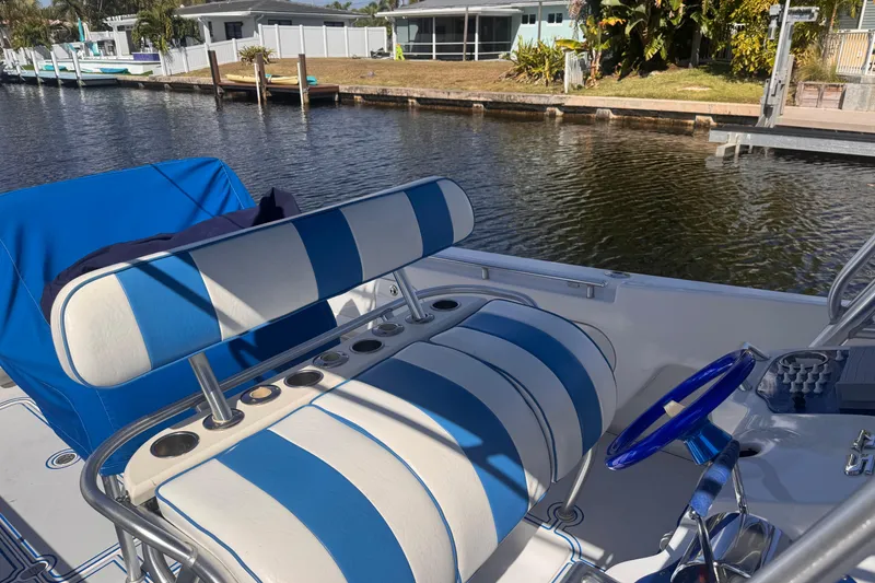 Slide: The Image of Blue and white striped seating on a 2004 Don Smith 45 Custom boat by a canal. - 18