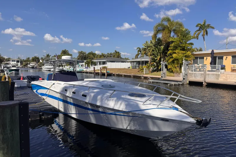 Slide: The Image of 2004 Don Smith 45 Custom boat docked in a sunny canal setting. - 19