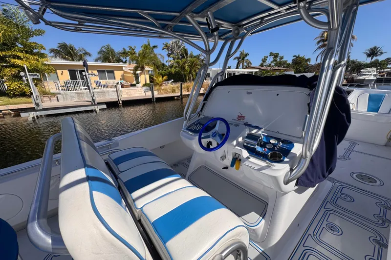 Slide: The Image of Interior of a 2004 Don Smith 45 Custom boat with blue and white seating. - 2