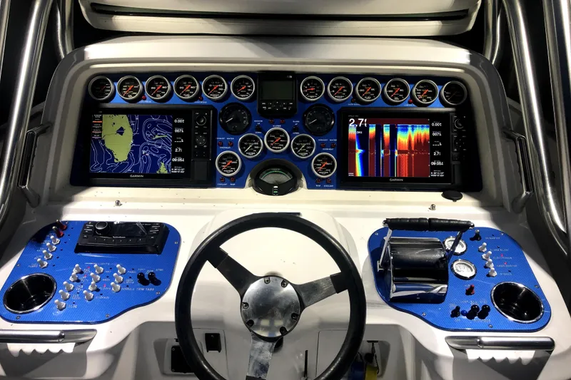 Slide: The Image of Control panel of a 2004 Don Smith 45 Custom boat with navigation screens and gauges. - 3
