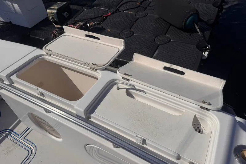 Slide: The Image of Open storage compartments on a 2004 Don Smith 45 Custom boat deck. - 8