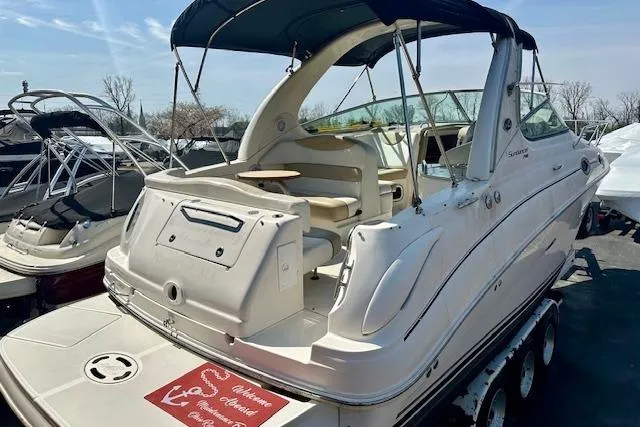 Slide: The Image of Dashboard of a 2009 Sea Ray Sundancer 280 boat with steering wheel and controls. - 11