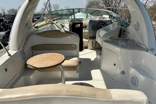 Slide: The Image of Interior of 2009 Sea Ray Sundancer 280 with dining area, kitchenette, and cozy sleeping quarters. - 12