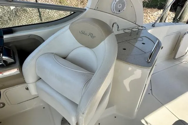 Slide: The Image of 2009 Sea Ray Sundancer 280 interior kitchen with sink, microwave, and wooden flooring. - 15